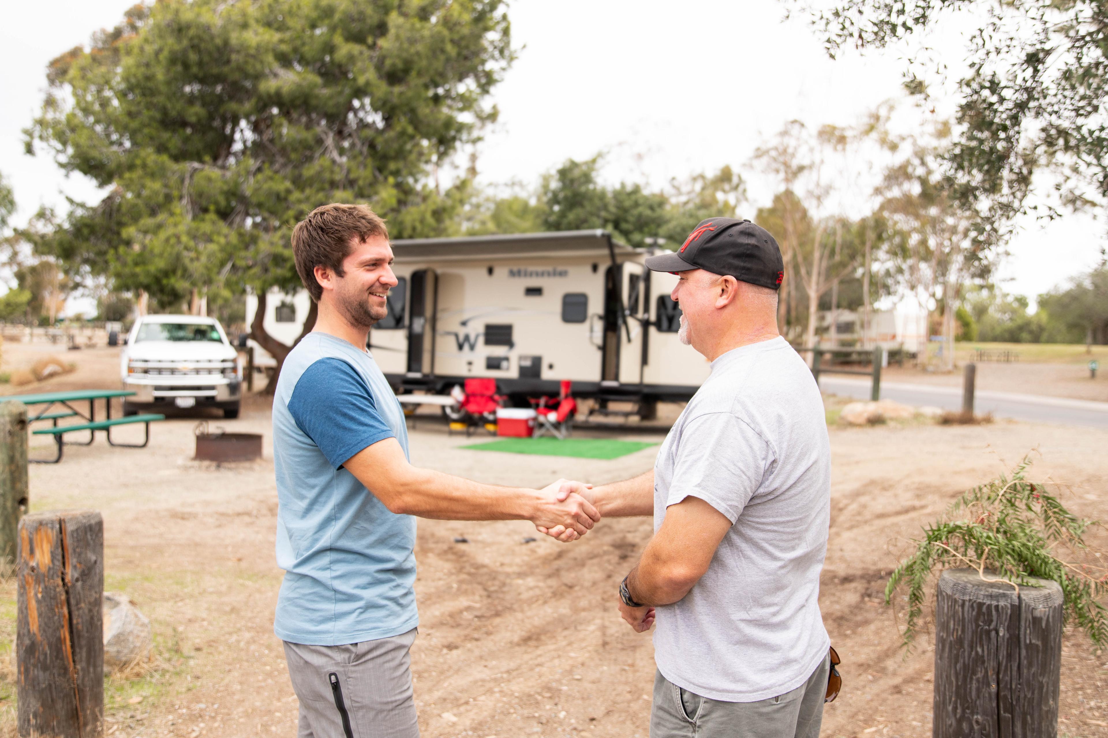 RV owners shaking hands 