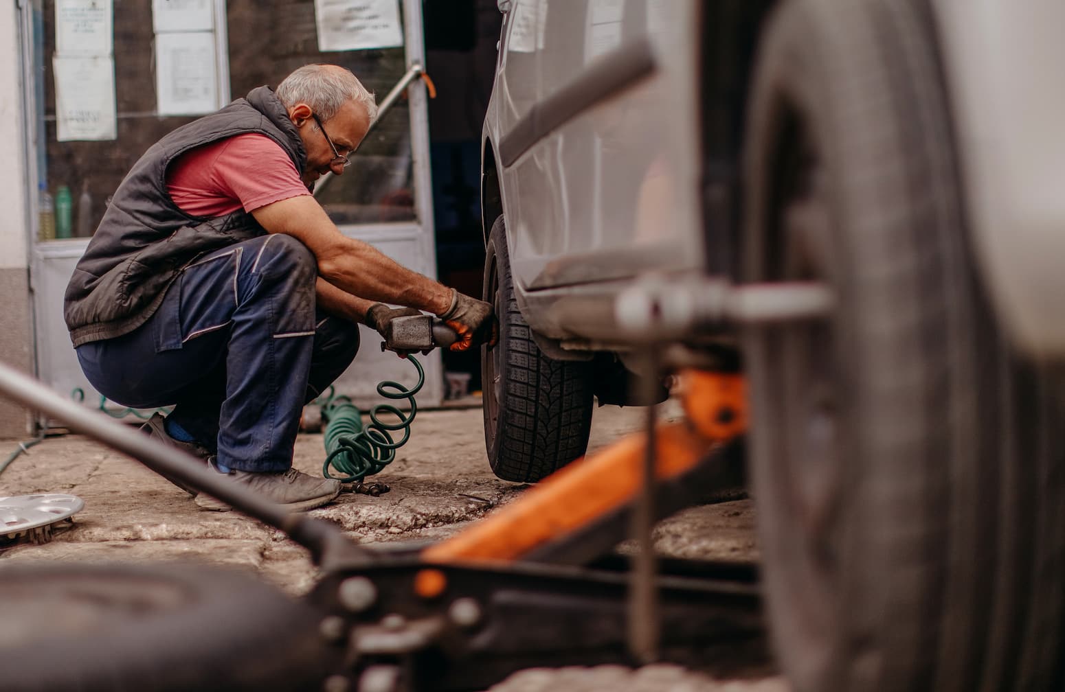 RV roadside assistance technician working on a vehicle