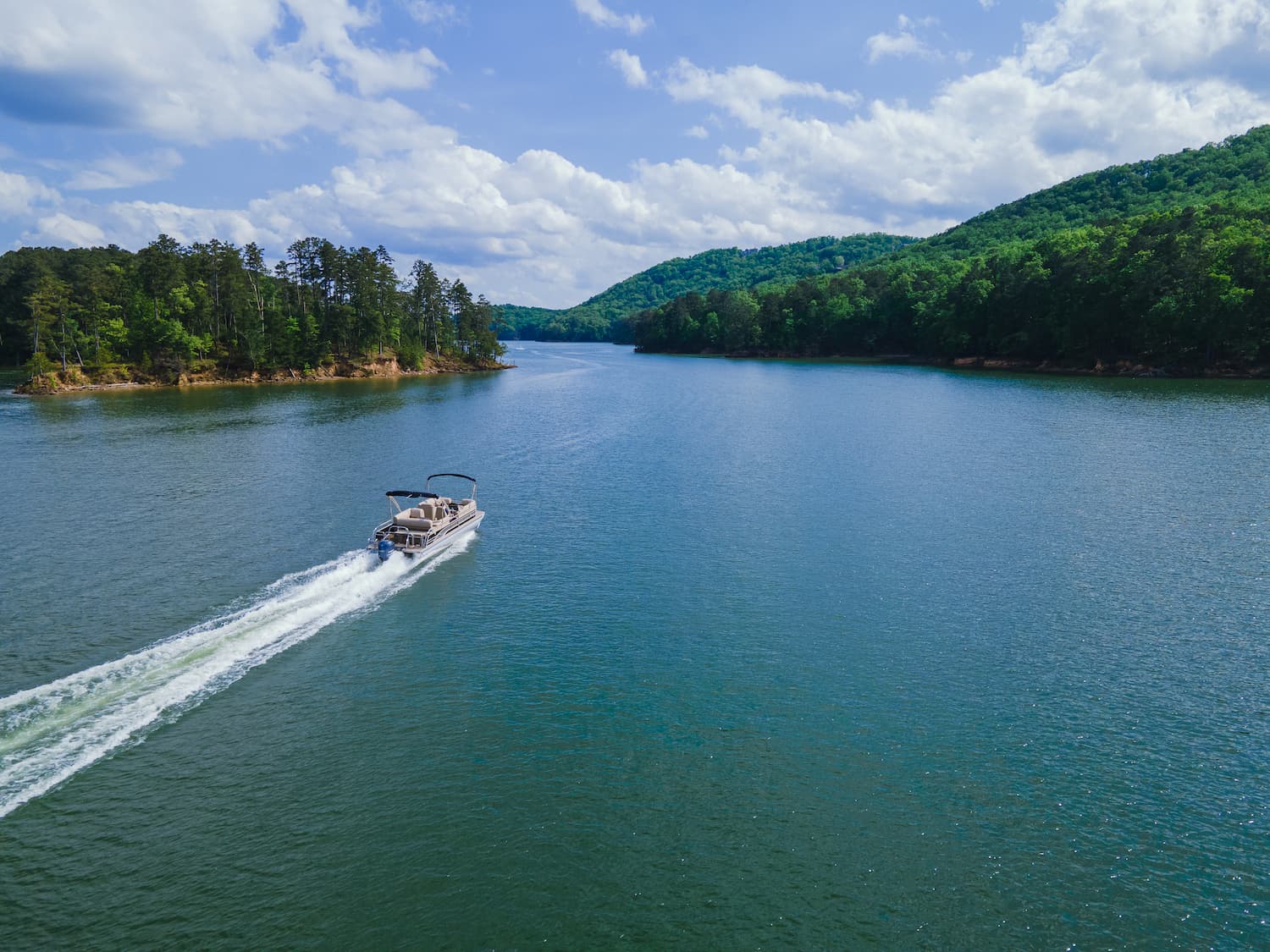 Boat interior showcasing personal effects coverage with fishing gear, electronics, and safety equipment